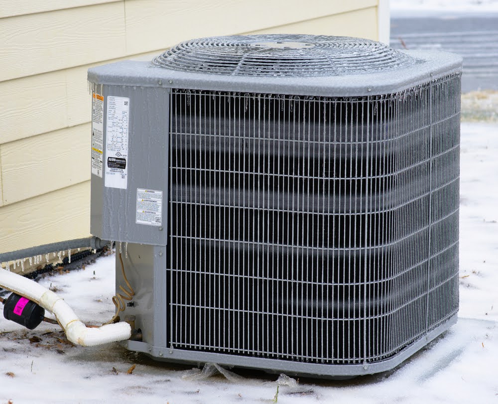 A frozen outdoor AC unit in the winter.