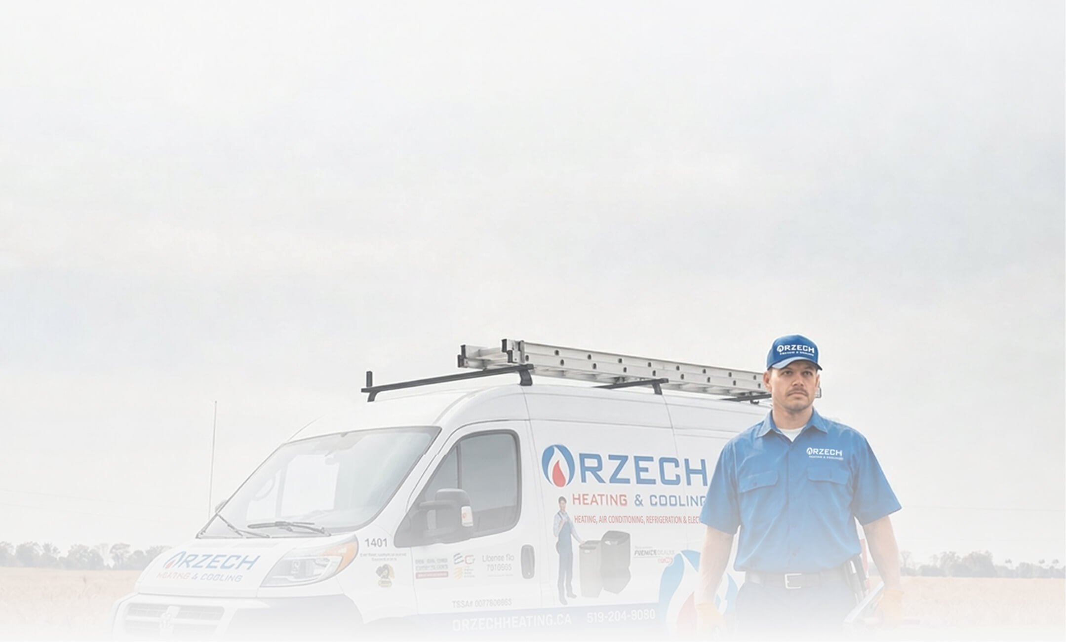 HVAC technician in a blue Orzech Heating and Cooling uniform stands beside a branded service van parked on a roadside. The technician holds tools and faces the camera while the company vehicle with ladders mounted on the roof is displayed prominently, highlighting professional heating and cooling service.